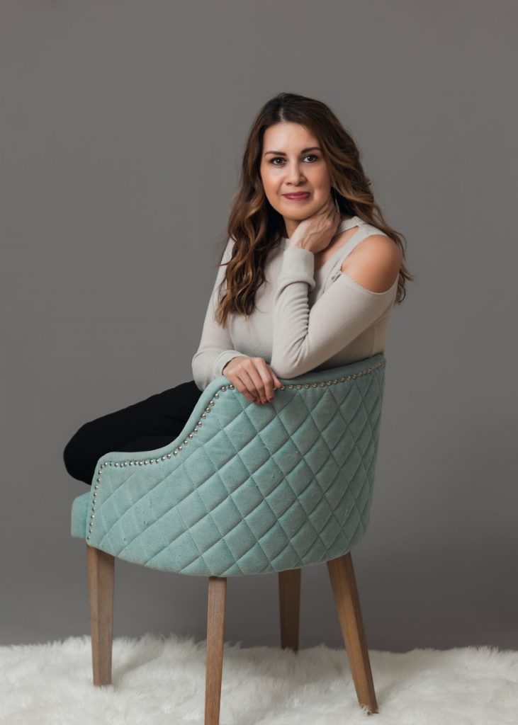 Lucy Brummett in chair photo shoot