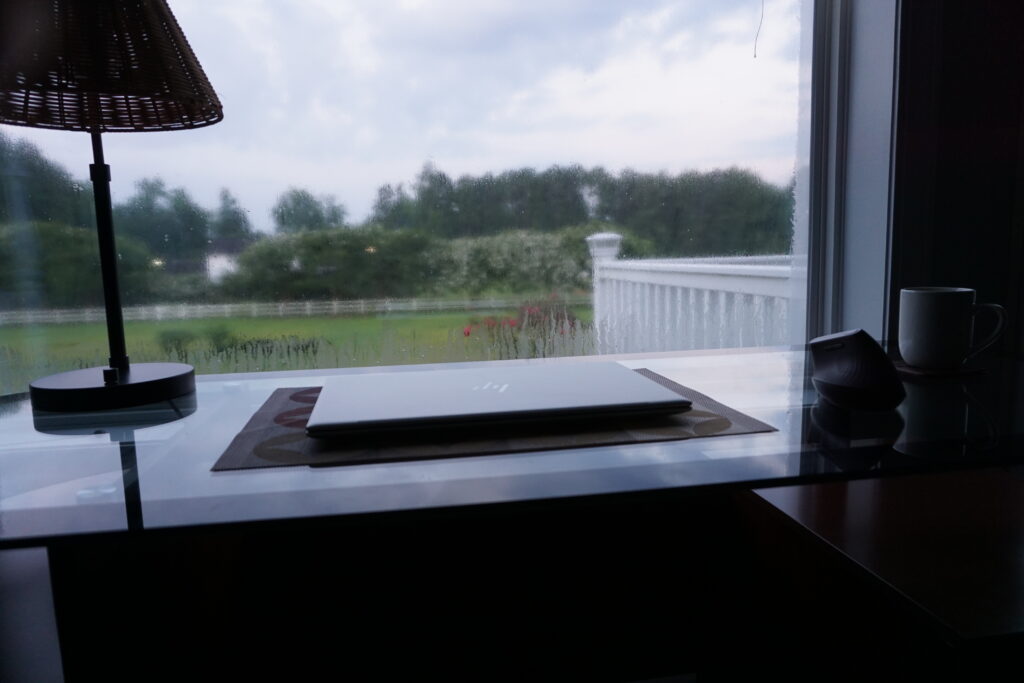 computer desk in front of window